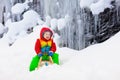 Boy on sled ride. Child sledding. Kid on sledge Royalty Free Stock Photo