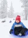 Boy sledding Royalty Free Stock Photo