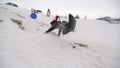 Boy sledding off jump slomo