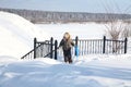 Boy with a sledge walks upstairs in the winter Royalty Free Stock Photo
