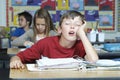 Boy Sleeping In Classroom