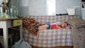 Boy sleeping on a sofa in a country house Royalty Free Stock Photo