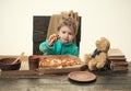 Boy with a slice of pizza. Snack for children.