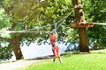 Boy slide at rope park easy low zip line for kids Royalty Free Stock Photo