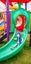 Boy sliding down at playground Royalty Free Stock Photo