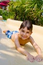 Boy Sliding Down Water Slide. Royalty Free Stock Photo