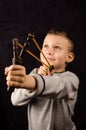 Boy with slingshot Royalty Free Stock Photo