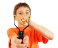 Boy with slingshot aim to camera