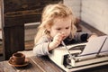 Boy or small kid with typewriter, paper and coffee cup Royalty Free Stock Photo