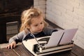 Boy or small kid with typewriter and paper Royalty Free Stock Photo