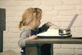 Boy or small kid with typewriter and paper Royalty Free Stock Photo