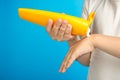 Boy smears his hands with children`s sunscreen Royalty Free Stock Photo