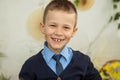 The boy smiles with crooked teeth. Royalty Free Stock Photo