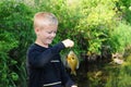 Boy Smiles Fishing Royalty Free Stock Photo