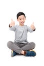 Boy smiles and showing thumb up over white Royalty Free Stock Photo