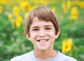 Boy Smiling in a Flower Field Royalty Free Stock Photo