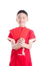 Boy smiling while holding red packet money isolated over white