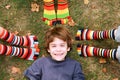 Boy Smiling Surrounded by Toe Socks Royalty Free Stock Photo