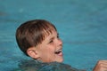 Boy smiling in swimming pool Royalty Free Stock Photo