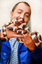 Boy with snakes. Man holds in hands reptile Common King snake Lampropeltis getula kind of snake. Royalty Free Stock Photo