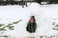 Boy in snow igloo