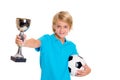 Boy with soccer ball and cup in front of white background Royalty Free Stock Photo