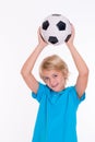 Boy with soccer ball in front of white background Royalty Free Stock Photo