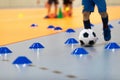 Boy in Soccer Clothes with Futsal Ball on Dribbling Drill. Kid on Indoor Soccer Training With Coach