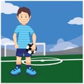 Boy soccer player with a ball in his hands on the football field Royalty Free Stock Photo