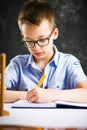 Boy solving math problems at home Royalty Free Stock Photo