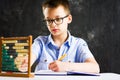 Boy solving math problems at home Royalty Free Stock Photo