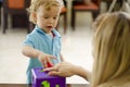 Boy solving a puzzle with his mom Royalty Free Stock Photo
