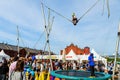 boy somersault jumping by cable machine Royalty Free Stock Photo