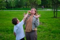 Boy son treats mom to ice cream, she refuses to eat Royalty Free Stock Photo