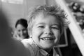 Boy spends fun time in playroom. Child with cheerful face Royalty Free Stock Photo