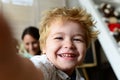 Boy spends fun time in playroom. Child with cheerful face