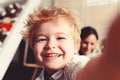 Boy spends fun time in playroom. Child with cheerful face Royalty Free Stock Photo