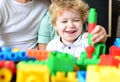 Boy spends fun time in playroom. Child with cheerful face Royalty Free Stock Photo