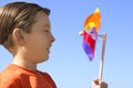 Boy with a spinning wheel pinwheel Royalty Free Stock Photo