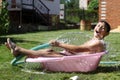 Boy with splash water in hot summer day Royalty Free Stock Photo