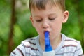 A boy and a spray bottle