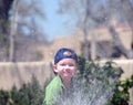Boy spraying water