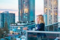 Boy standing on balcony admiring the view from a highrise apartment in Surfers Paradise on the Gold Coast, Queensland Australia Royalty Free Stock Photo