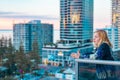 Boy standing on balcony admiring the view from a highrise apartment in Surfers Paradise on the Gold Coast, Queensland Australia Royalty Free Stock Photo