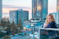 Boy standing on balcony admiring the view from a highrise apartment in Surfers Paradise on the Gold Coast, Queensland Australia Royalty Free Stock Photo