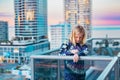 Boy standing on balcony admiring the view from a highrise apartment in Surfers Paradise on the Gold Coast, Queensland Australia Royalty Free Stock Photo