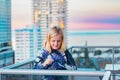 Boy standing on balcony admiring the view from a highrise apartment in Surfers Paradise on the Gold Coast, Queensland Australia Royalty Free Stock Photo