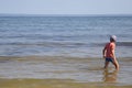 A boy is standing in the Baltic Sea Royalty Free Stock Photo