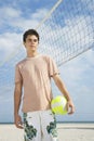 Boy Standing On Beach Volleyball Court Royalty Free Stock Photo