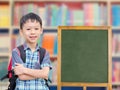 Boy standing near by chalkboard Royalty Free Stock Photo